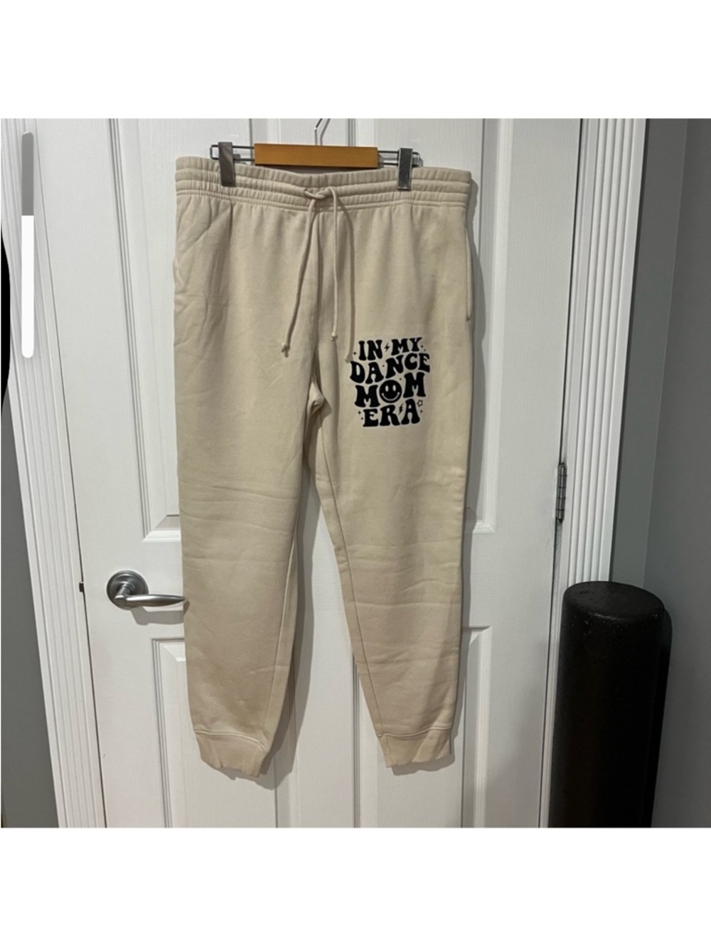 Beige Sweatpants with Black Graphic Text